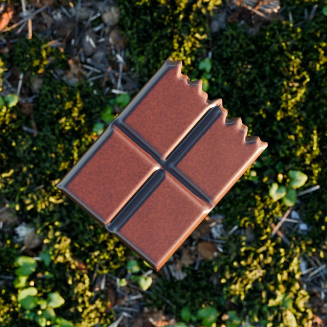 Included cacao chunk with chocolate squares and a broken edge